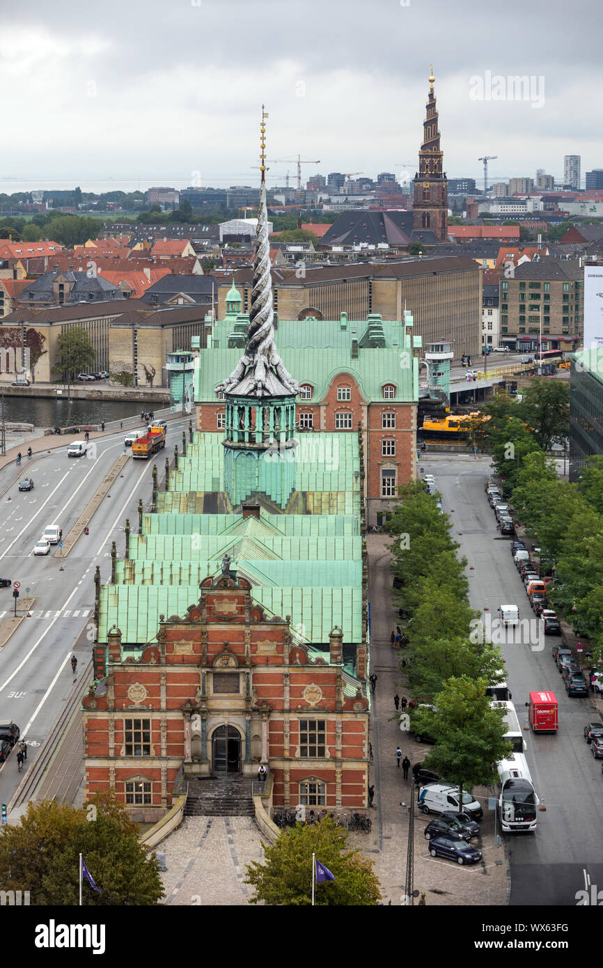 The former stock exchange, the 17th century Børsen, in Copenhagen, with the spire of the Church of Our Saviour in the distance Stock Photo