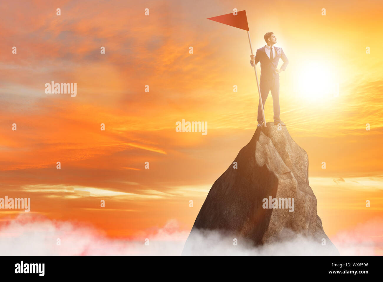 Businessman at the top of mountain Stock Photo - Alamy