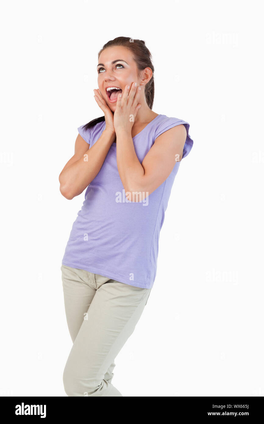 Young female surprised against a white background Stock Photo - Alamy