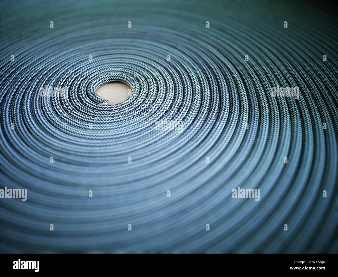 Spiral rug made with climbing rope. Floor yarn carpet Stock Photo - Alamy