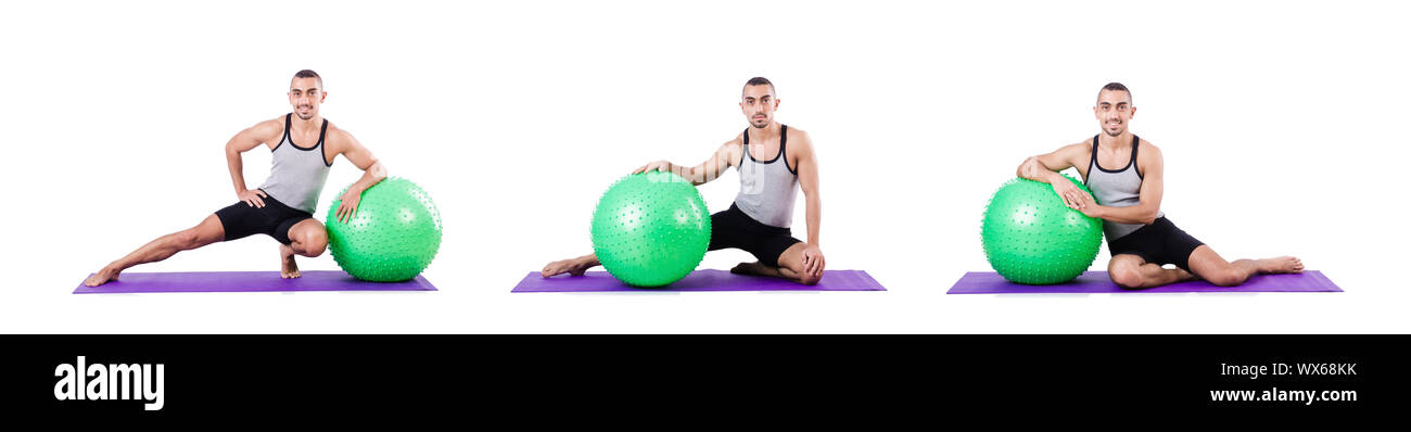 Man with swiss ball doing exercises on white Stock Photo - Alamy