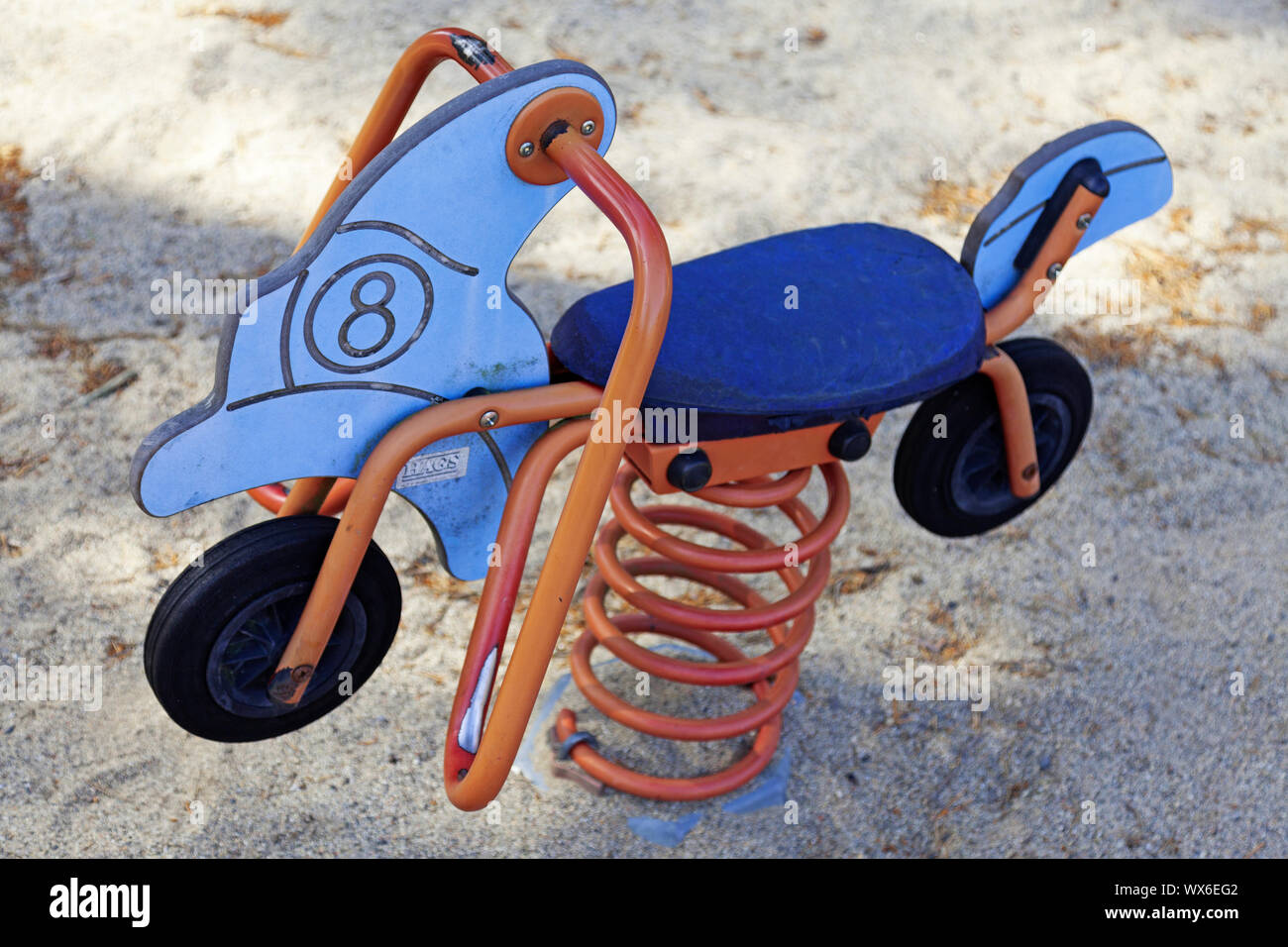 Umea, Sweden - August 14, 2019: toy motorcycle in playground with sand Stock Photo