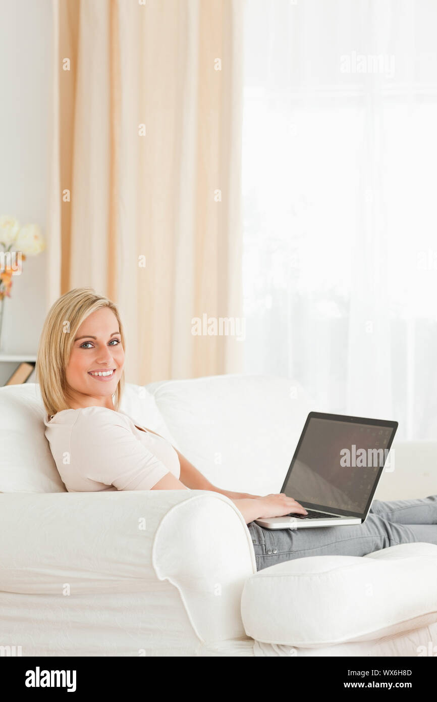 Portrait of a blond-haired woman with a notebook Stock Photo
