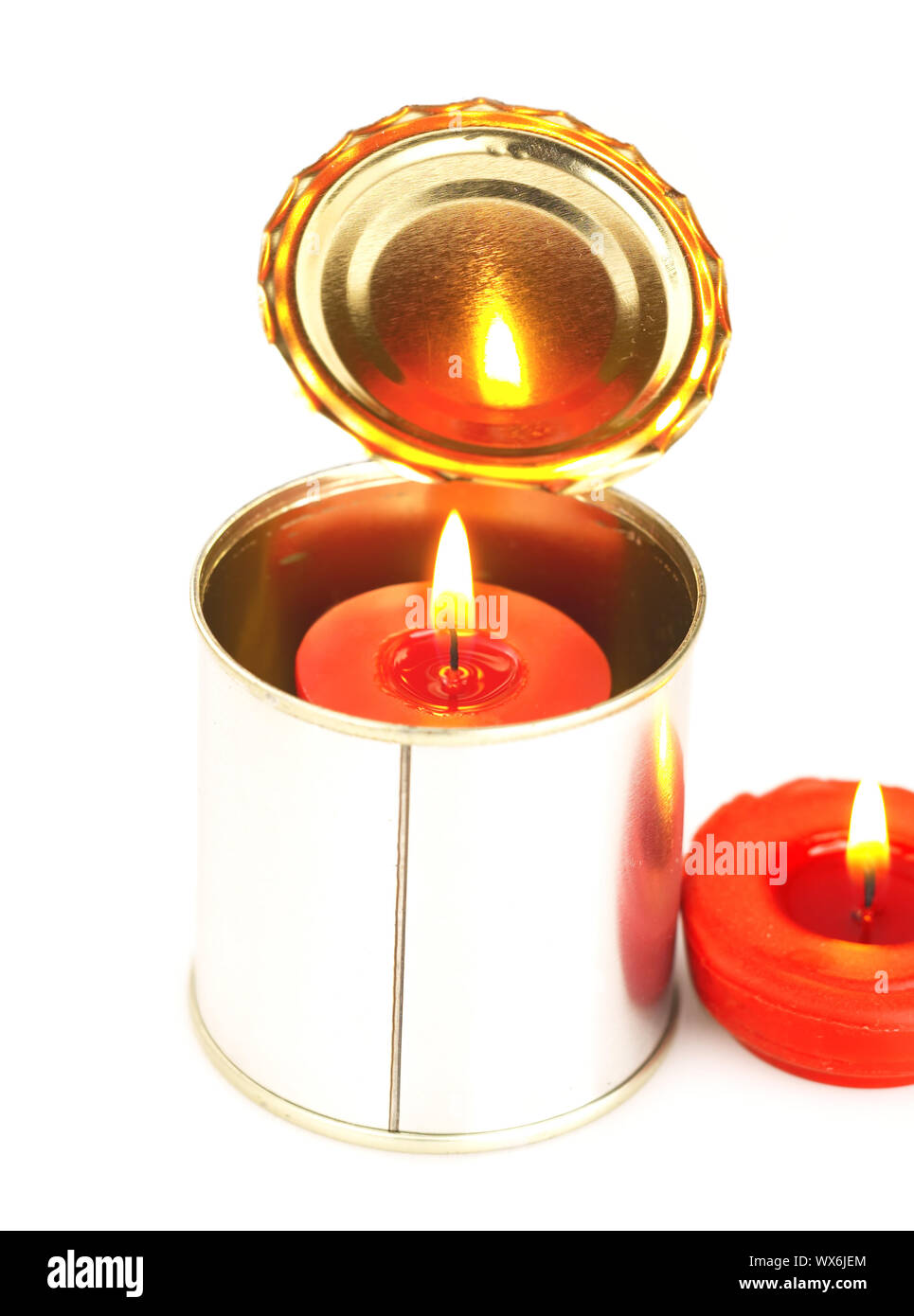 candle on a tin can Stock Photo Alamy