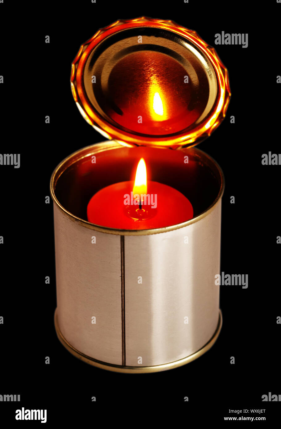 candle on a tin can Stock Photo Alamy