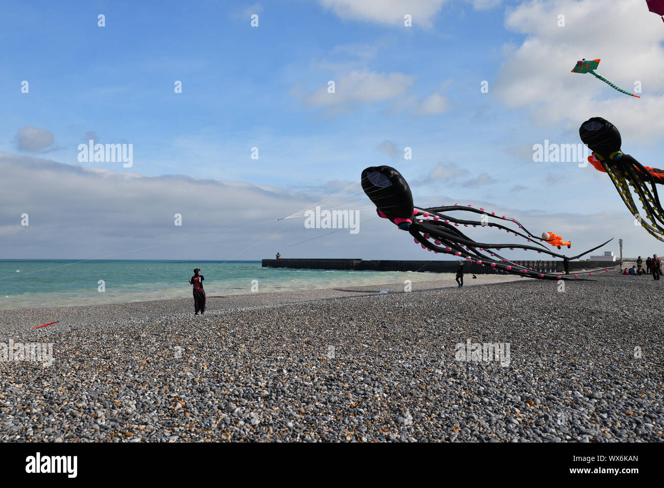 DIEPPE, FRANCE - SEPTEMBER 11, 2018: Kite festival. Octopus kites in the sky in Atlantic ocean Stock Photo