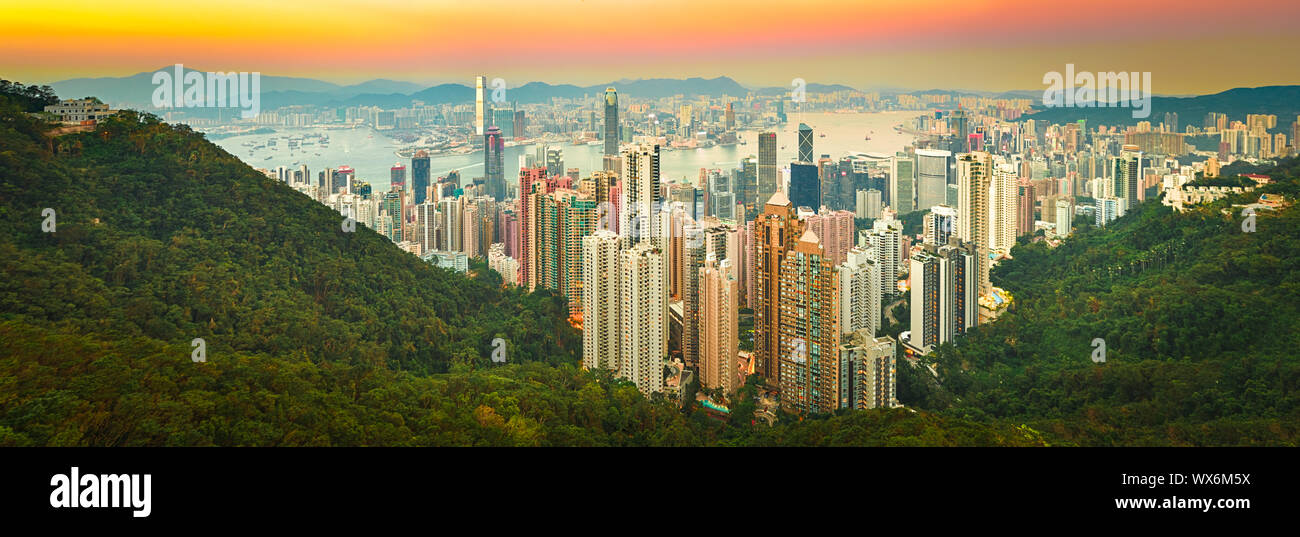 Hong Kong skyline at sunset. Panorama Stock Photo