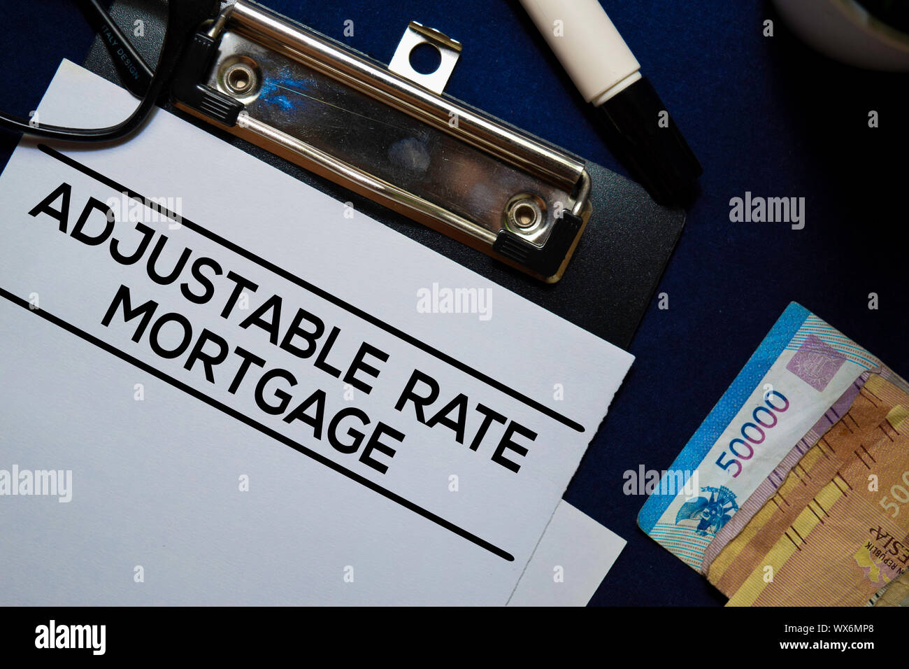 Adjustable Rate Mortgage text on Document form isolated on office desk ...