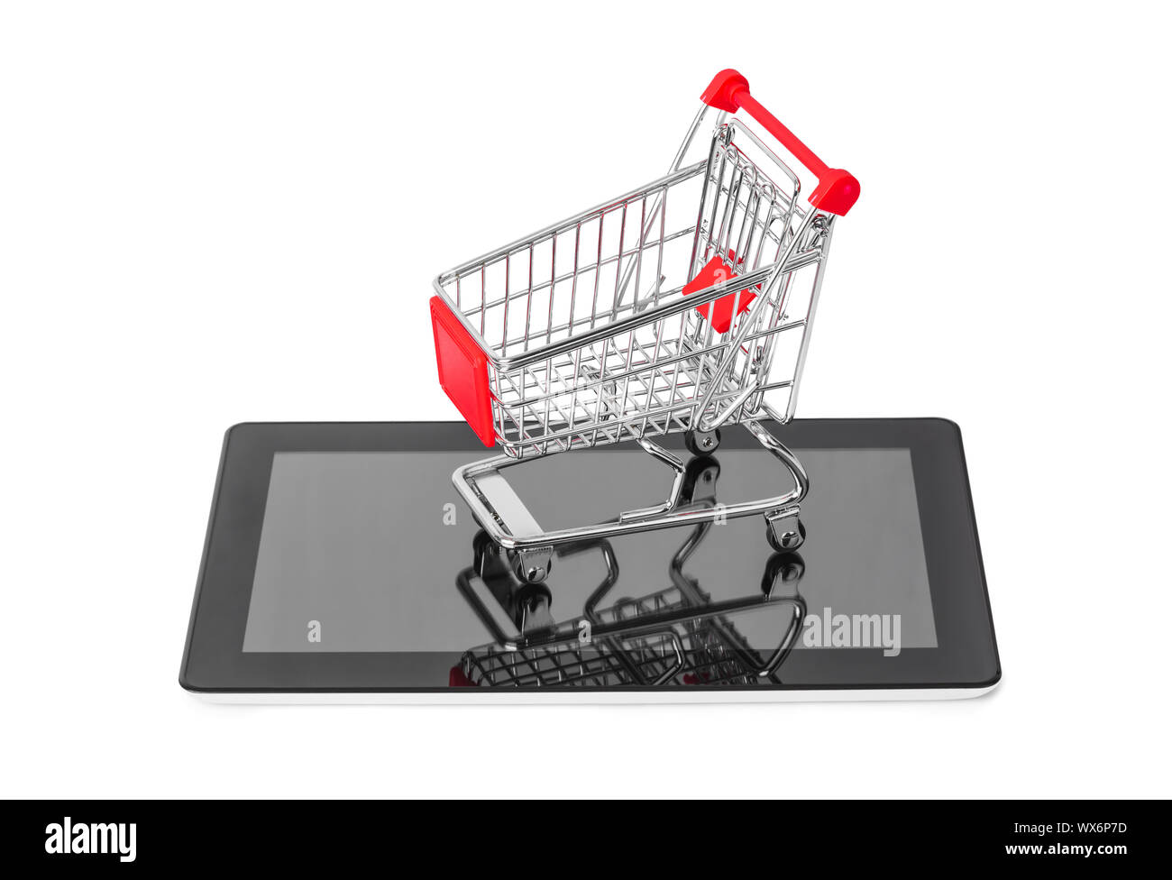 Tablet pc and shopping cart Stock Photo