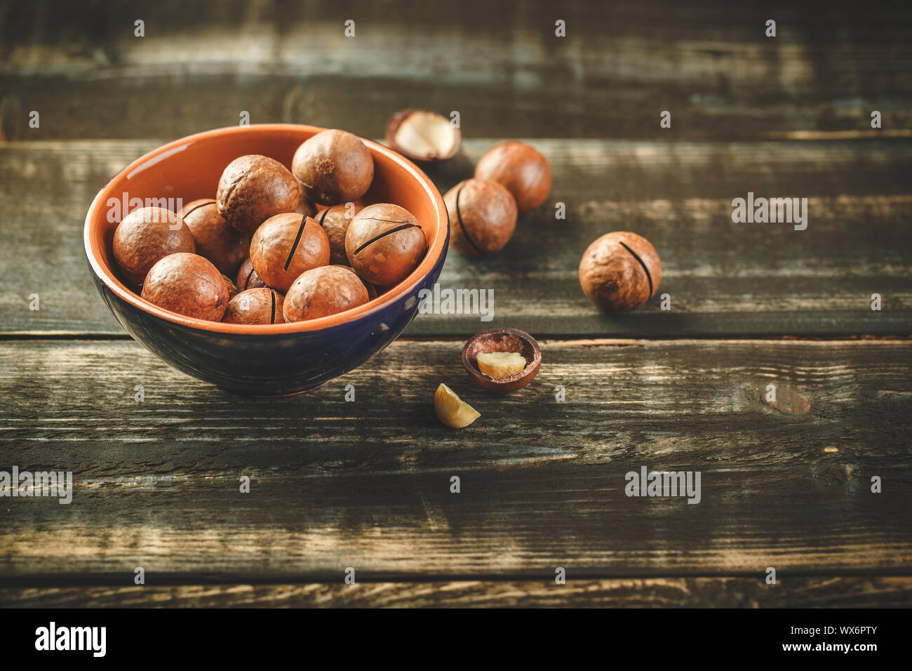 Macadamia nuts on wooden table Stock Photo