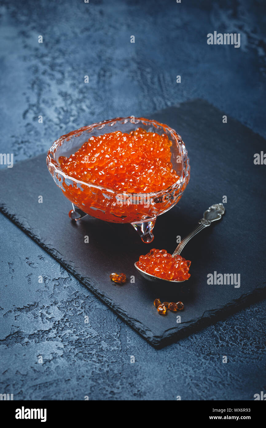 Salmon caviar in glass plate Stock Photo