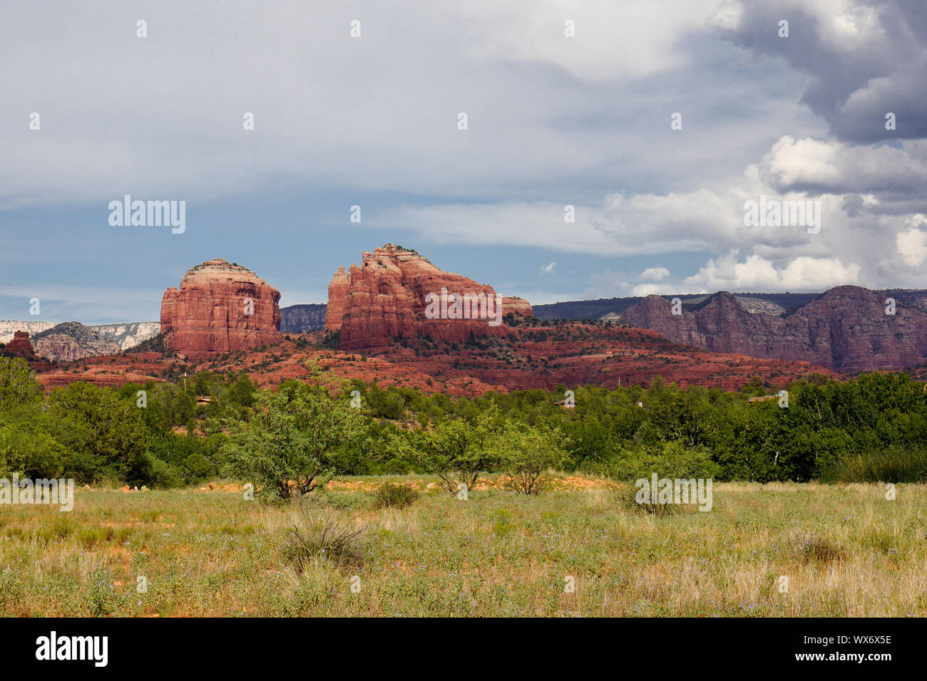 meadow forest and red rock mountain Stock Photo