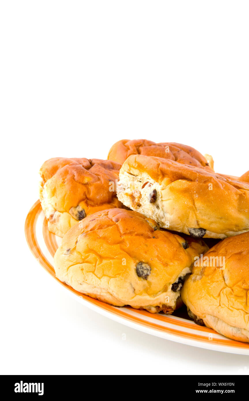 bread rolls filled with currants on a plate Stock Photo