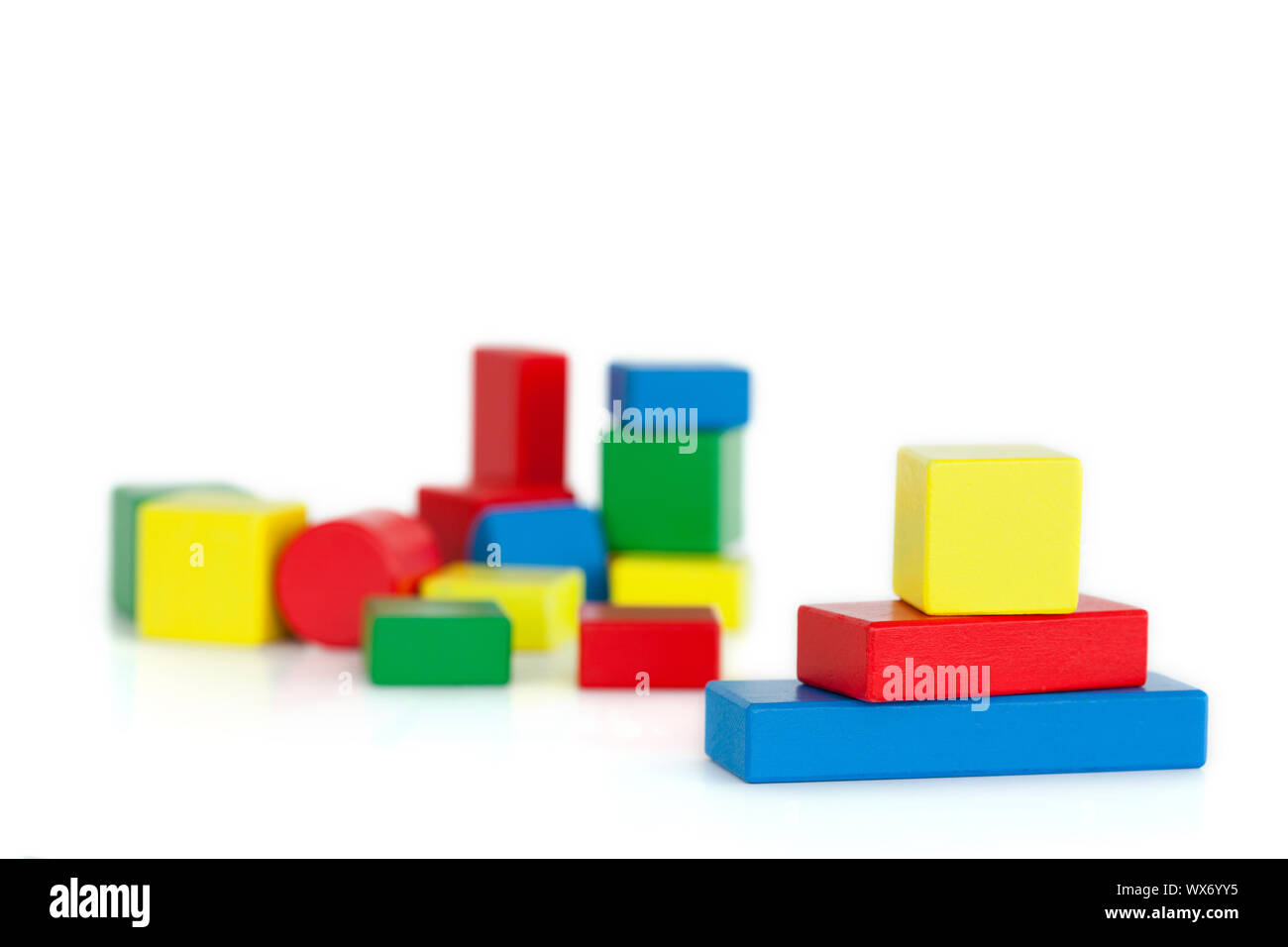 Color children's wooden blocks on a white background Stock Photo - Alamy