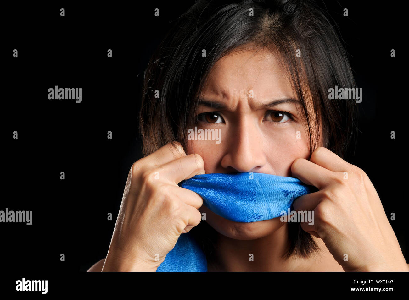 girl-gagged-with-blue-scarf-pulls-to-free-her-voice-stock-photo-alamy