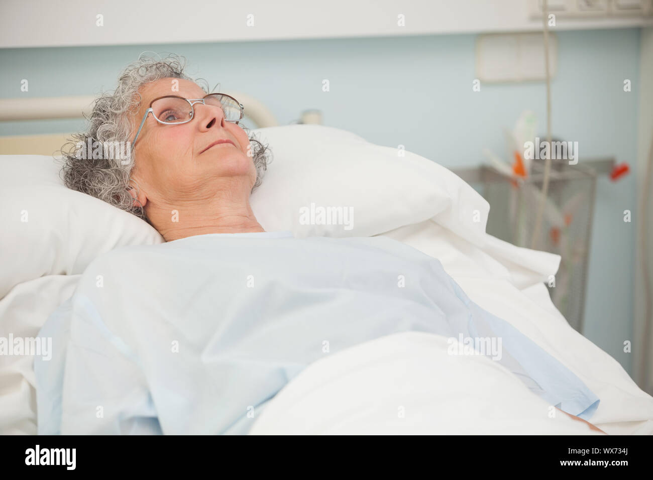 Old sick lady lying in hospital bed Stock Photo Alamy