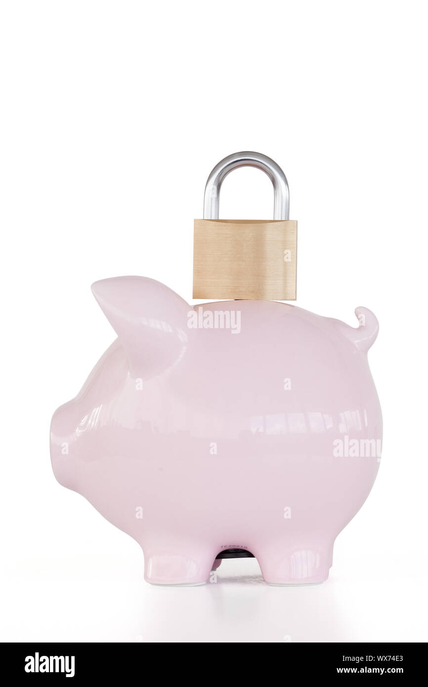 Side view of pink piggy bank and padlock against a white background ...