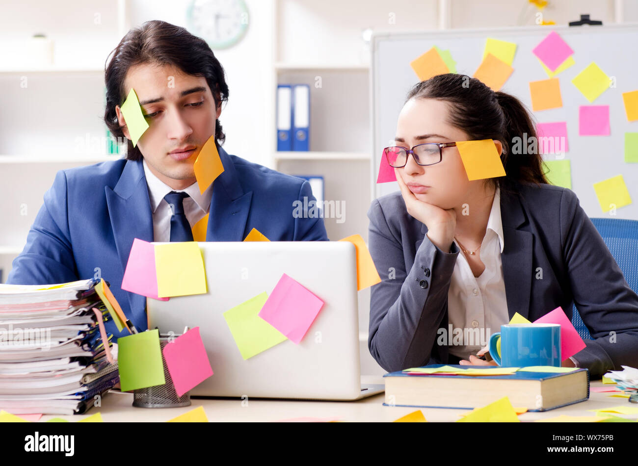 Two colleagues employees working in the office Stock Photo - Alamy
