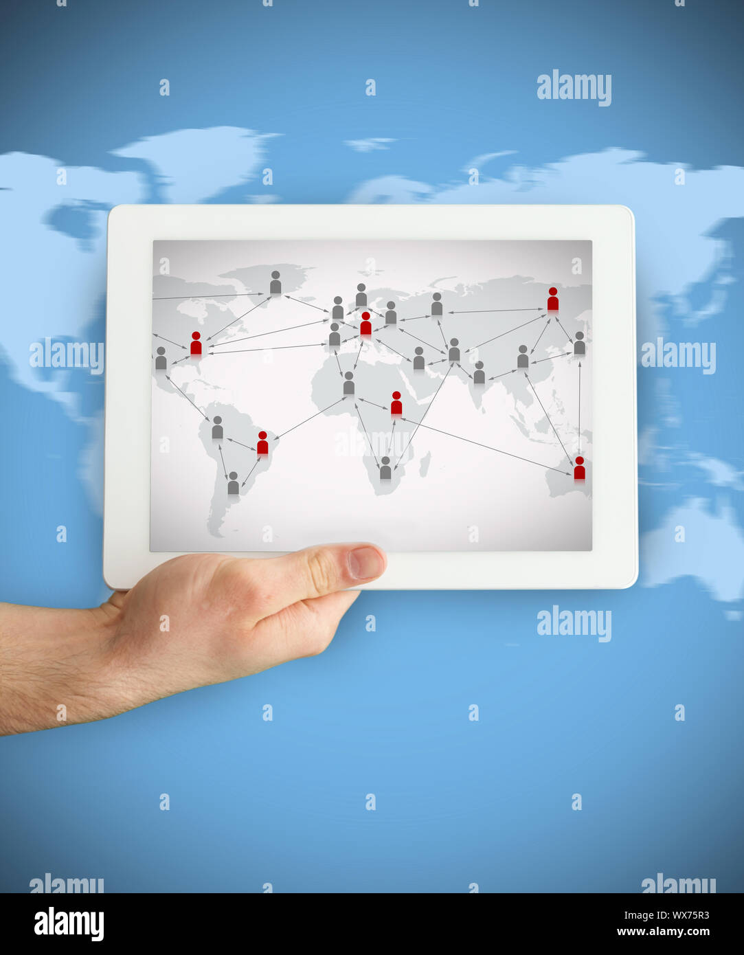 Hand showing a tablet PC displaying world map with connecting figures Stock Photo