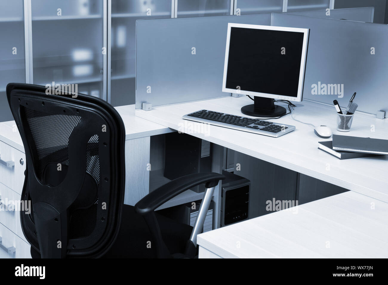 computer behind the glass in modern office Stock Photo