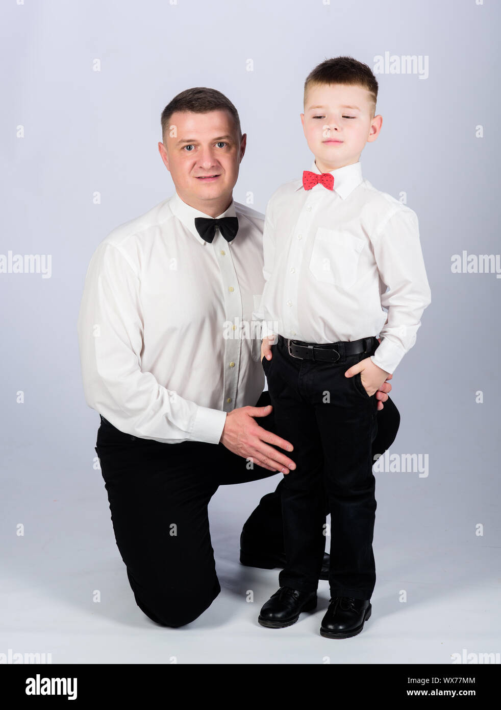 Dad And Boy With Bow Ties Gentleman Upbringing Formal Event Little Son Following Fathers Example Of Noble Man Gentleman Upbringing Father And Son Formal Clothes Outfit Grow Up Gentleman Stock Photo