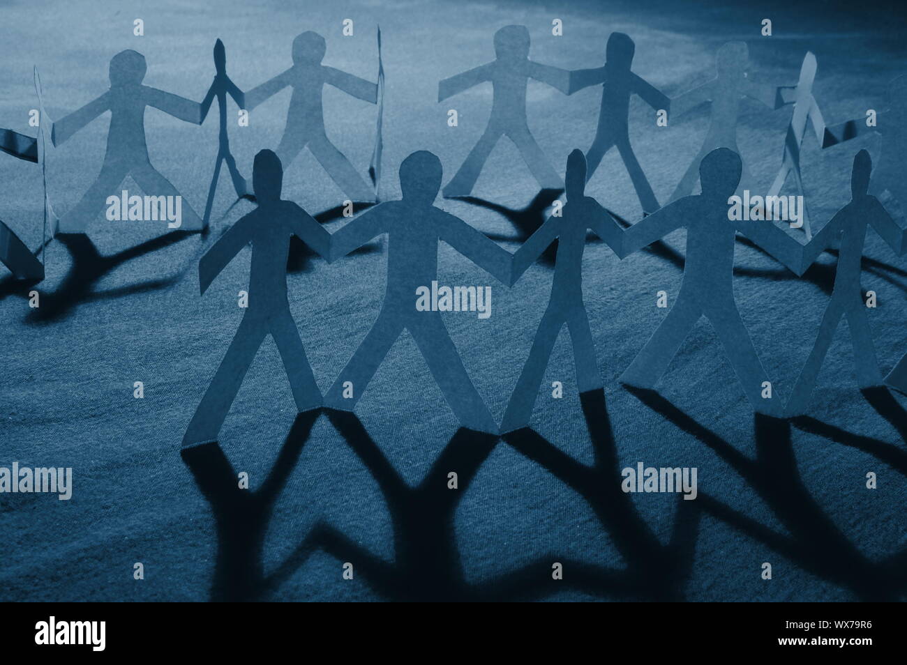 team of paper people having a party Stock Photo Alamy