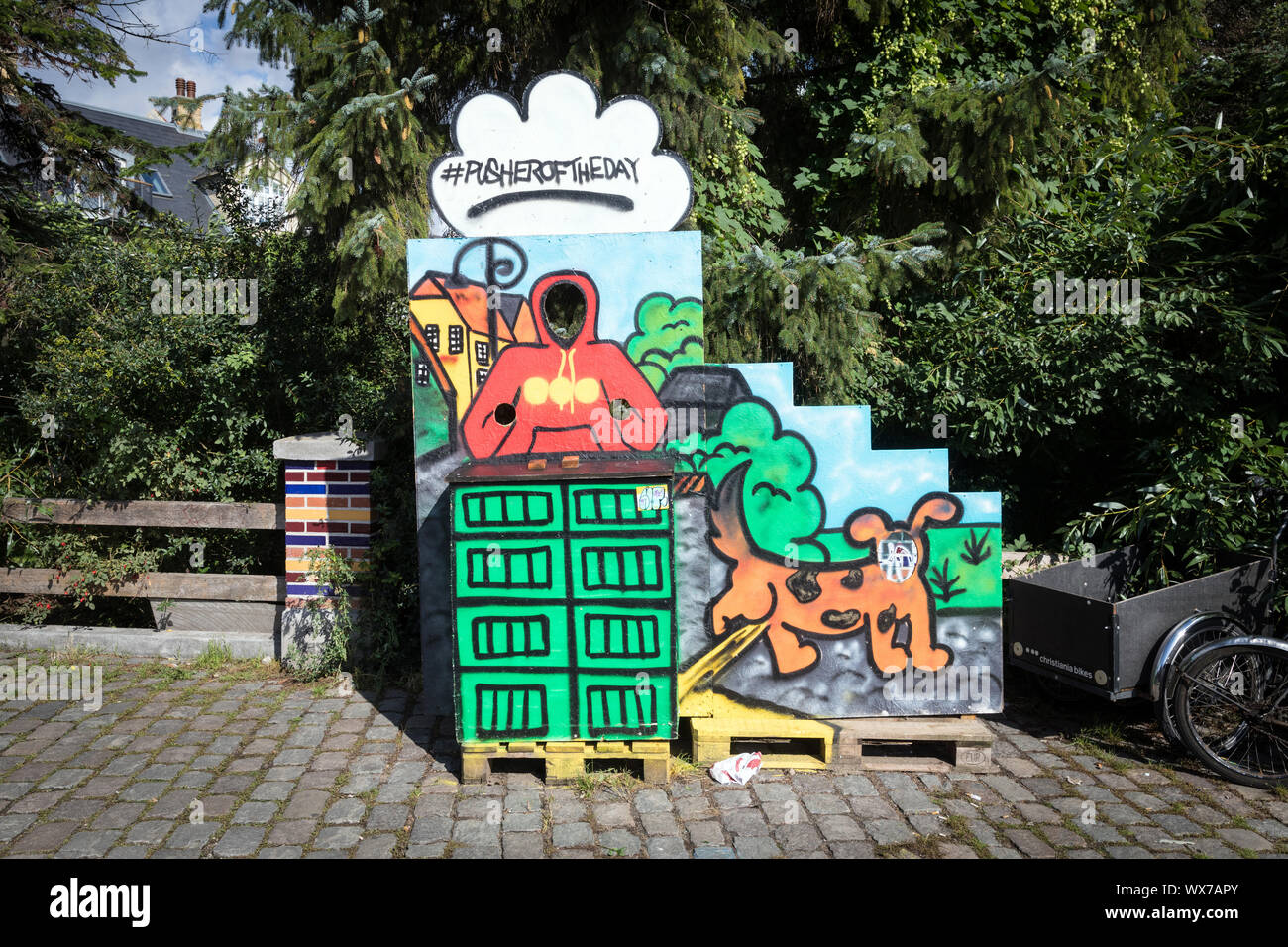 A 'pusher of the day' photo stand in Freetown Christiania, Christianshavn, Copenhagen Stock Photo