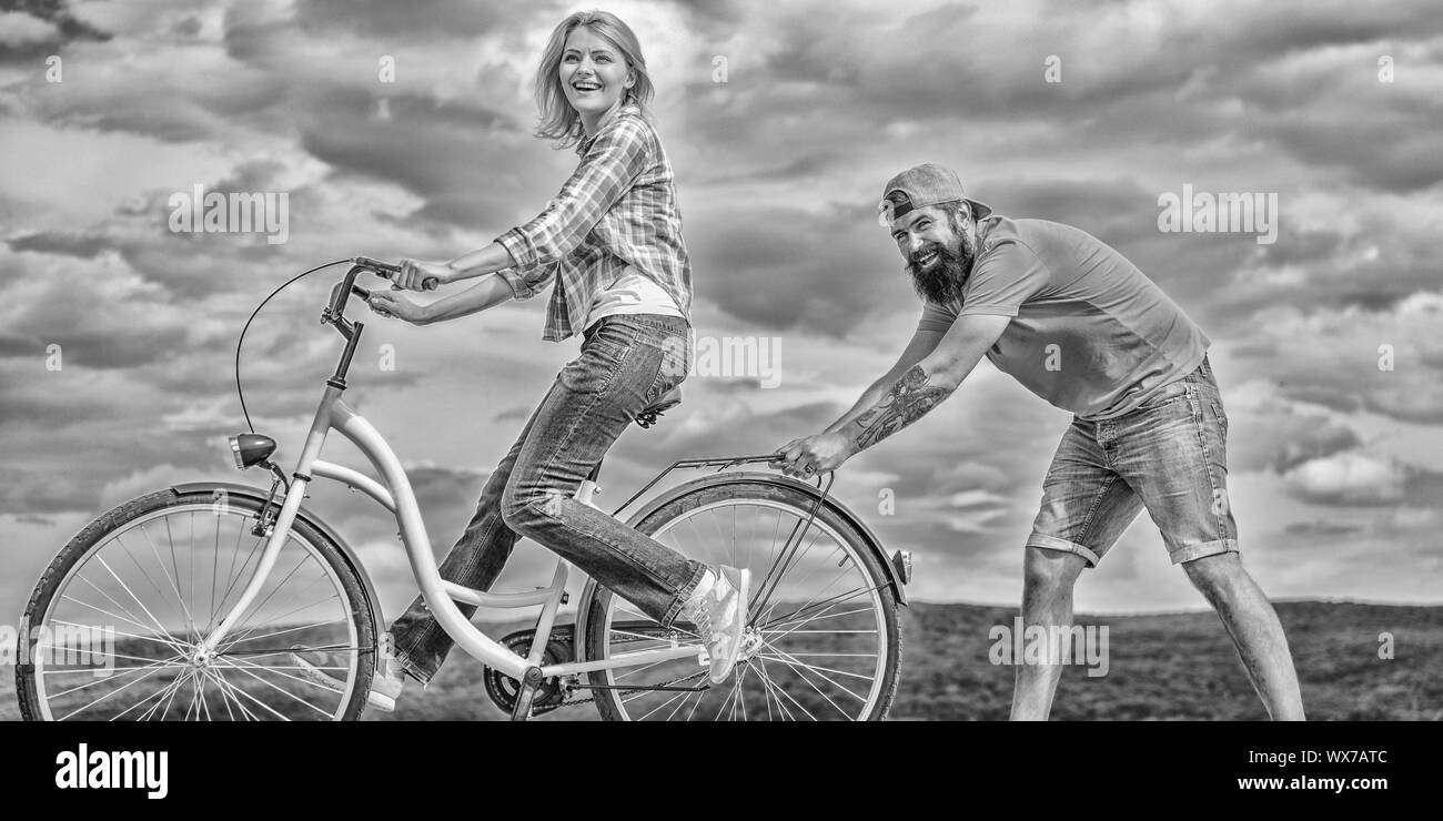 Teach Adult To Ride Bike Find Balance Woman Rides Bicycle Sky Background How To Learn To Ride Bike As An Adult Girl Cycling While Boyfriend Support Her Man Helps Keep Balance And Teach Adult To Ride Bike Find Balance Woman Rides Bicycle Sky Background How To Learn To Ride Bike As An Adult Girl Cycling While Boyfriend Support Her Man Helps Keep Balance And