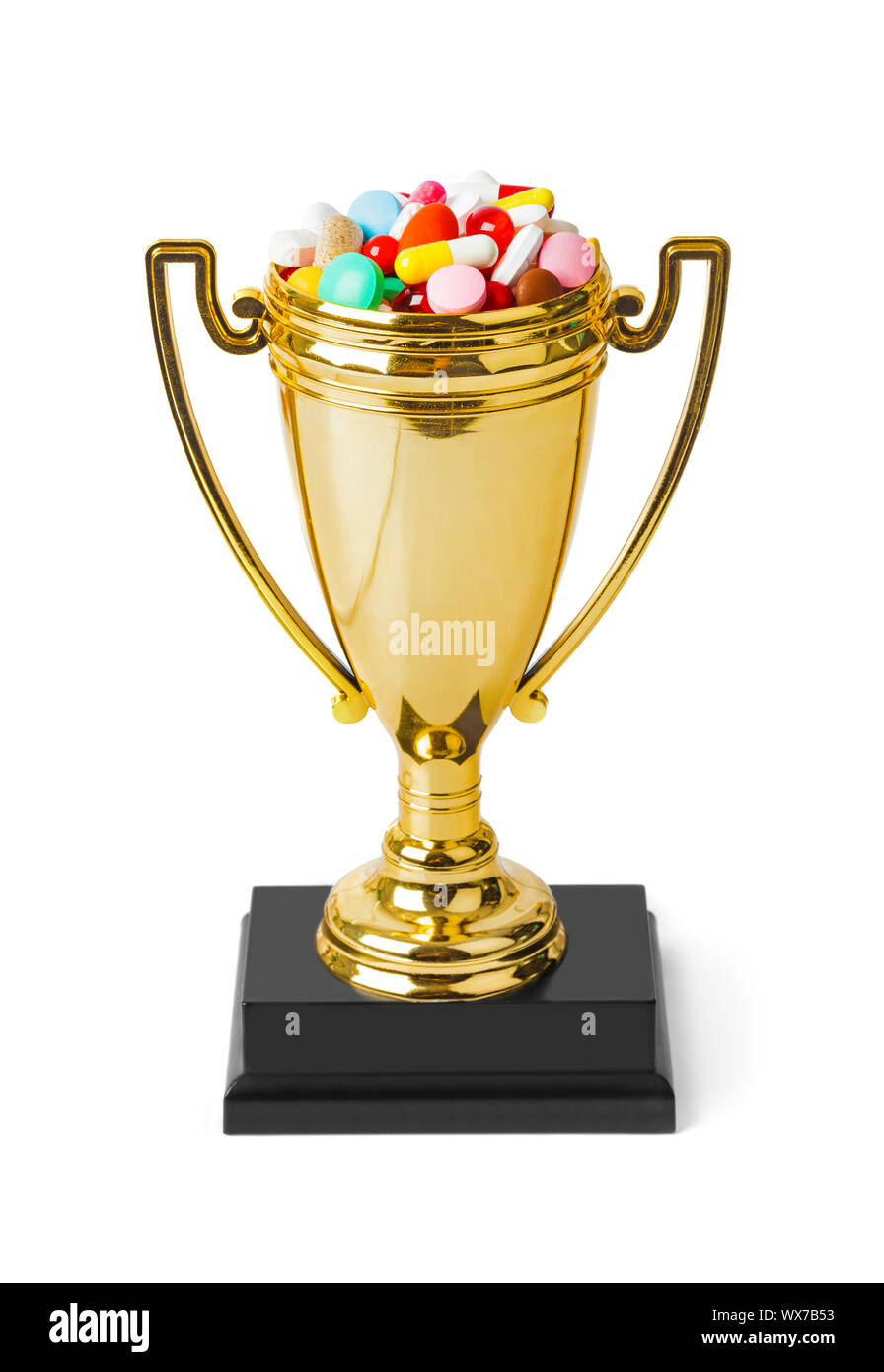 Golden trophy cup with pills Stock Photo