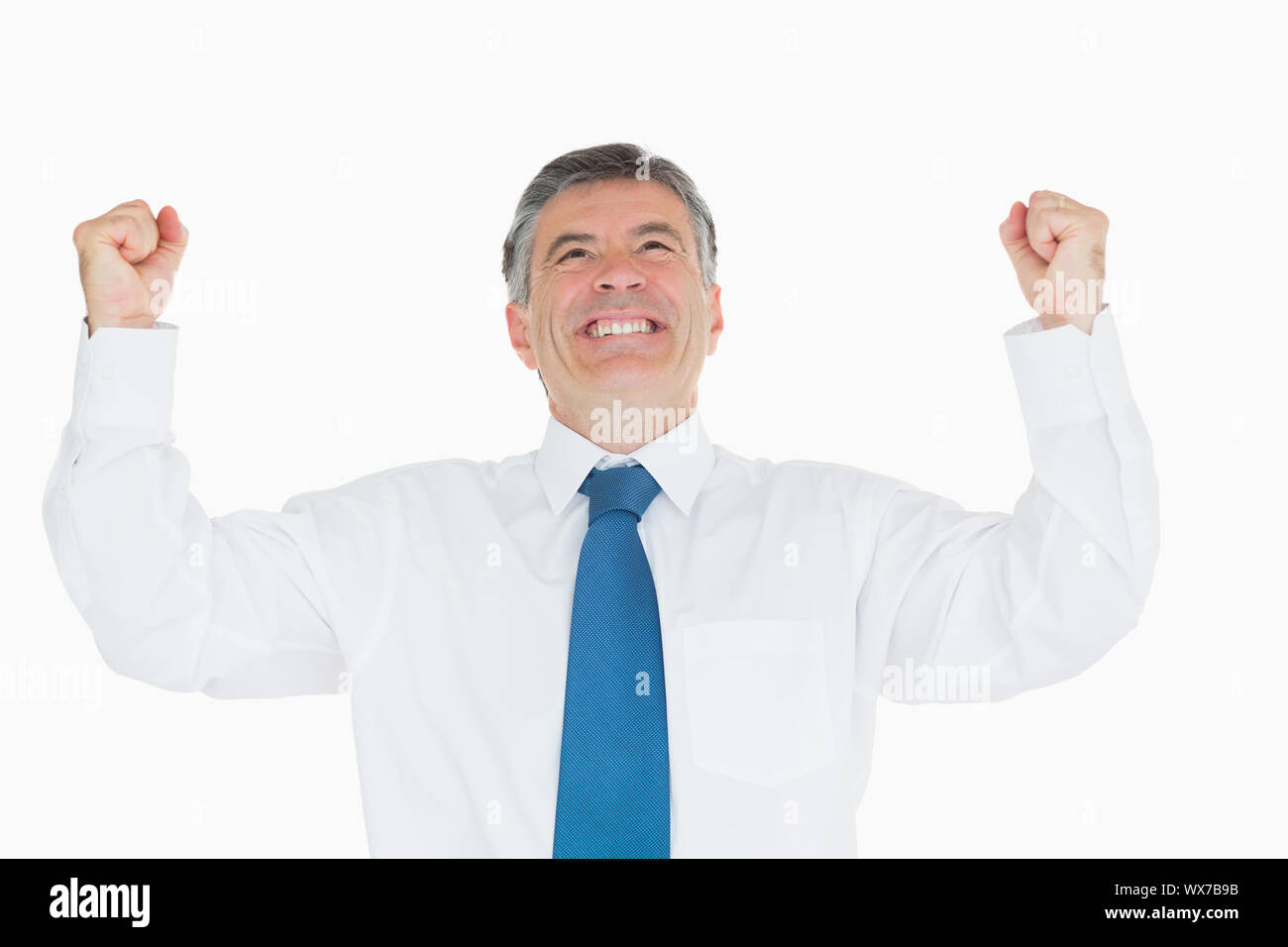 Succesful businessman cheering Stock Photo - Alamy