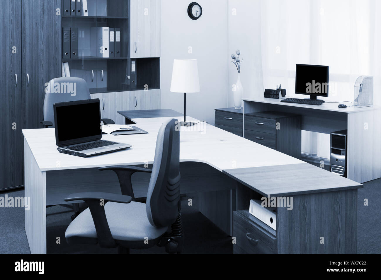 workplaces with computers in modern office Stock Photo