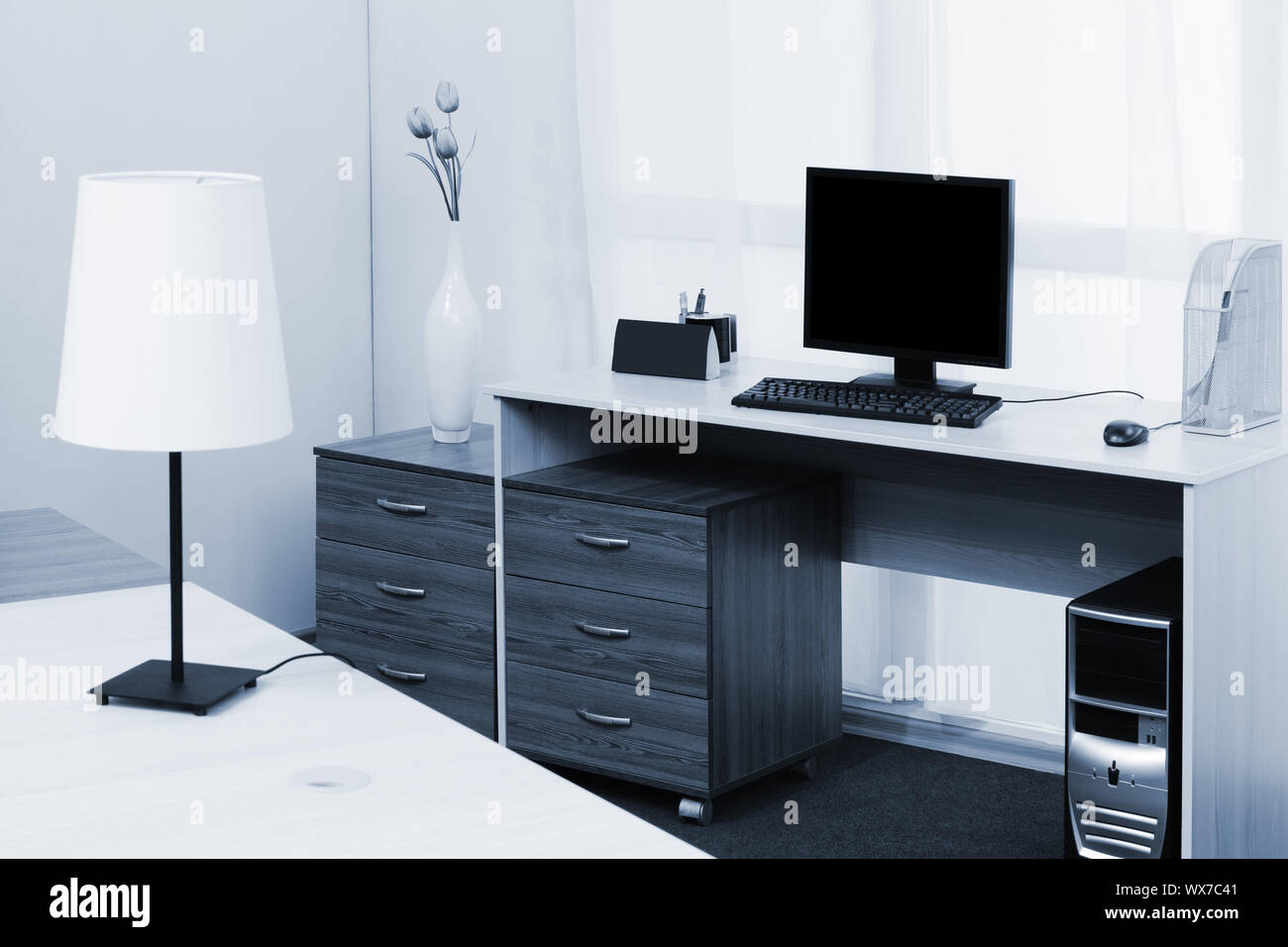 computer on a desk in a office Stock Photo