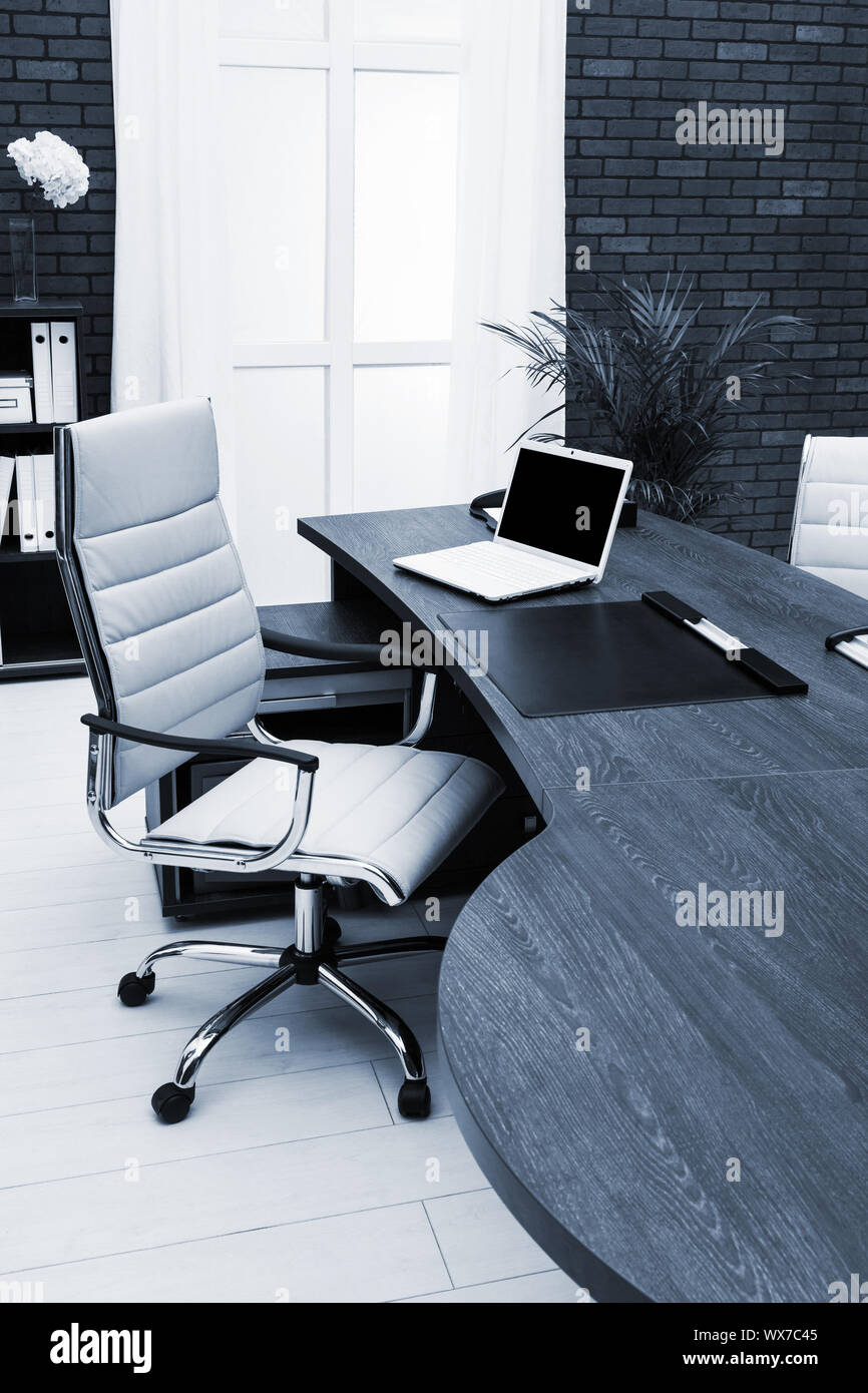 workplace with laptop in office Stock Photo