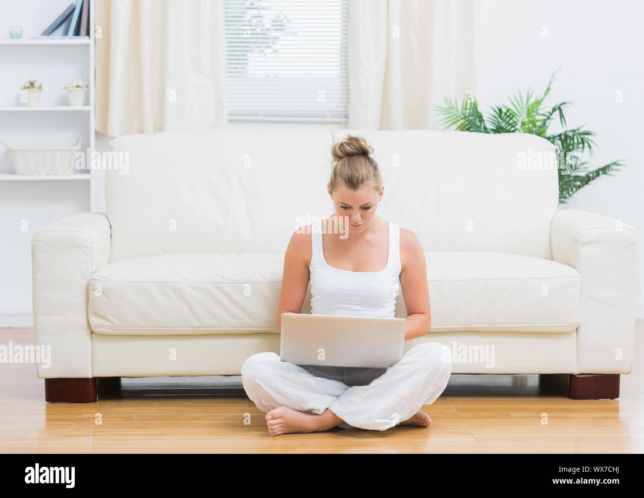 Happy white blonde woman typing hi-res stock photography and images - Alamy