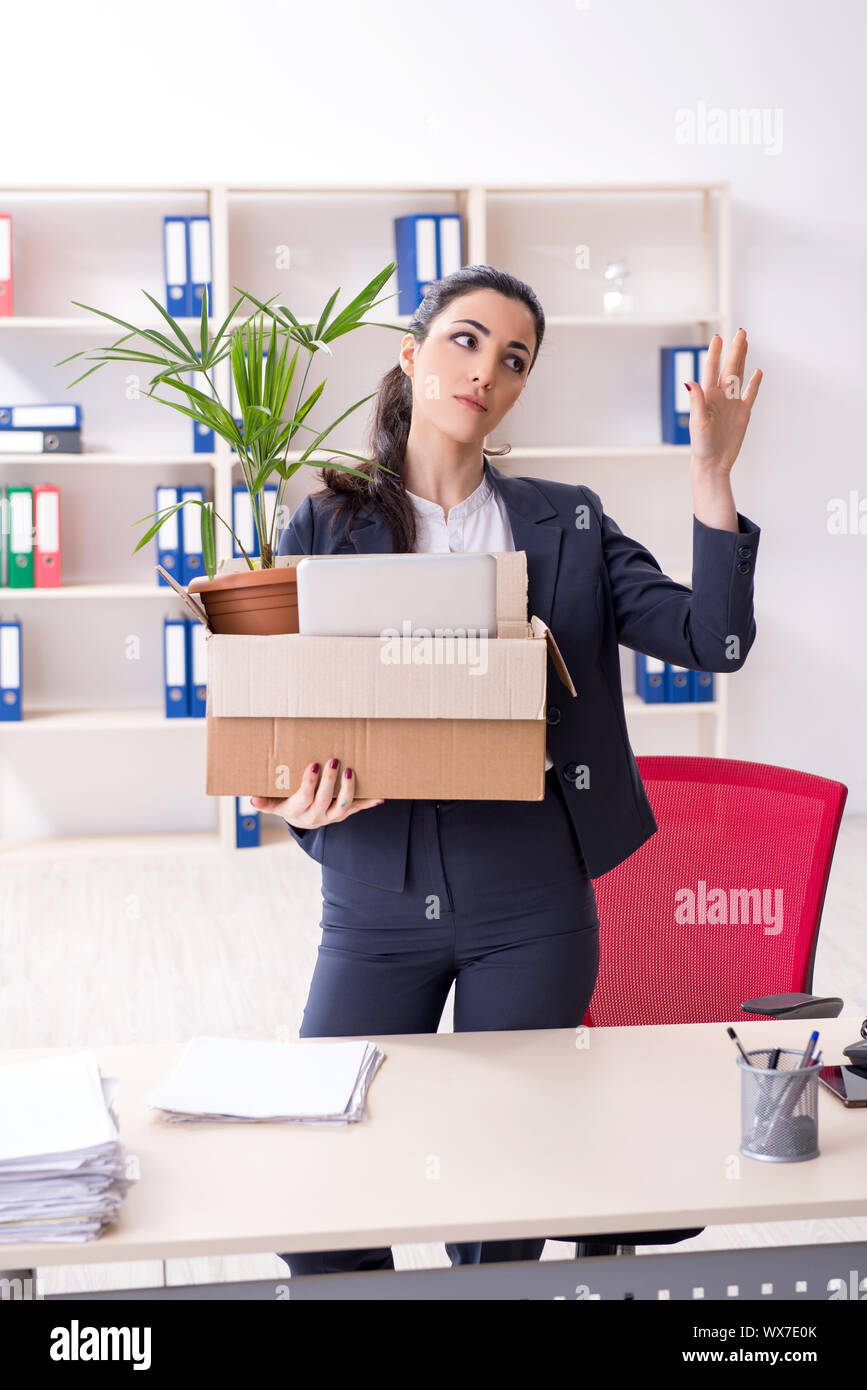 Young female employee being fired from her work Stock Photo