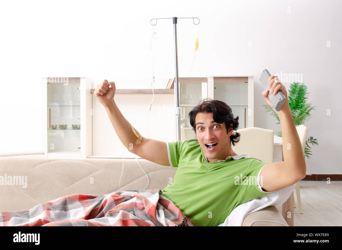 Young man suffering at home Stock Photo