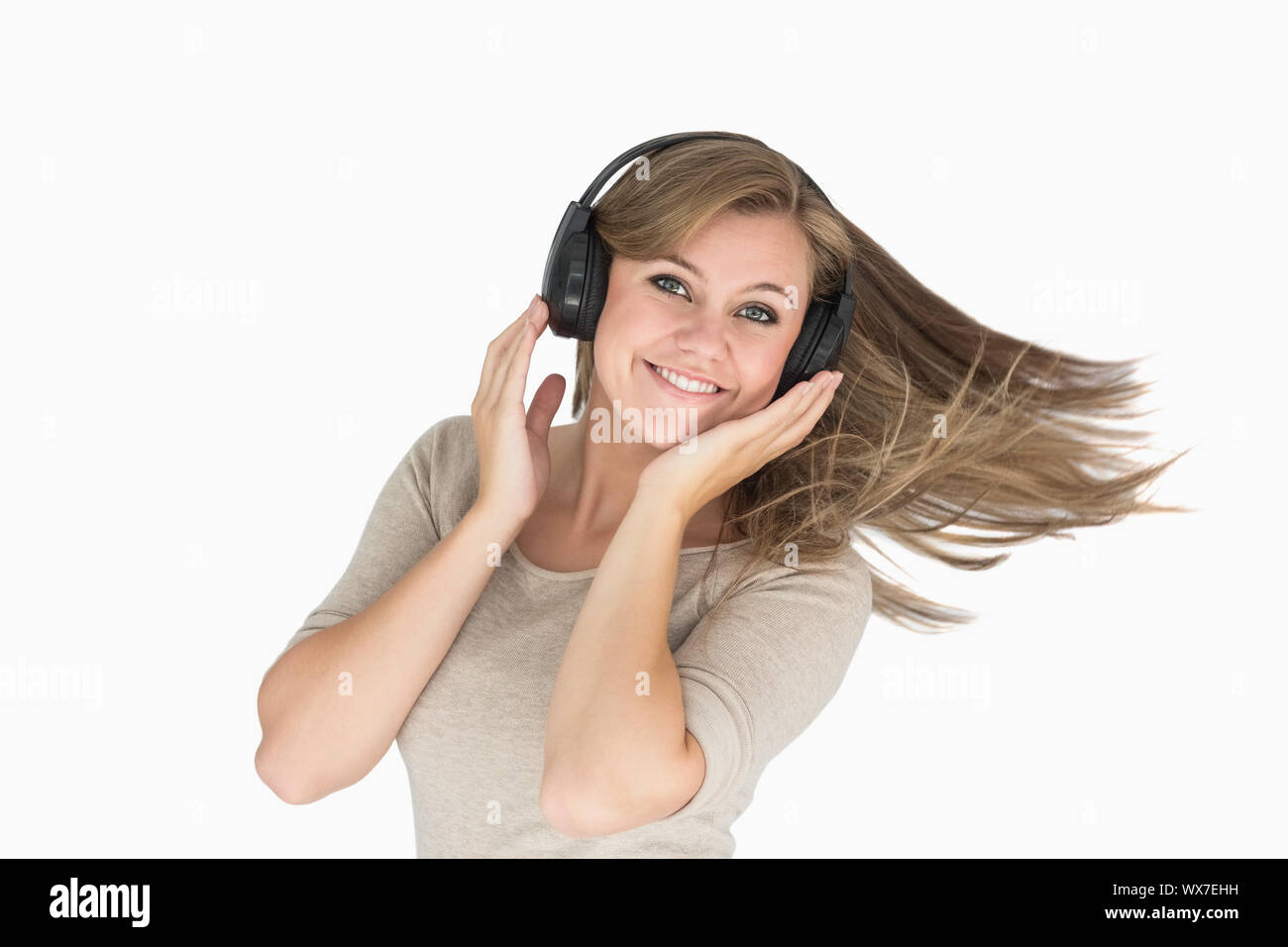 Woman dancing with headphones on white background Stock Photo - Alamy