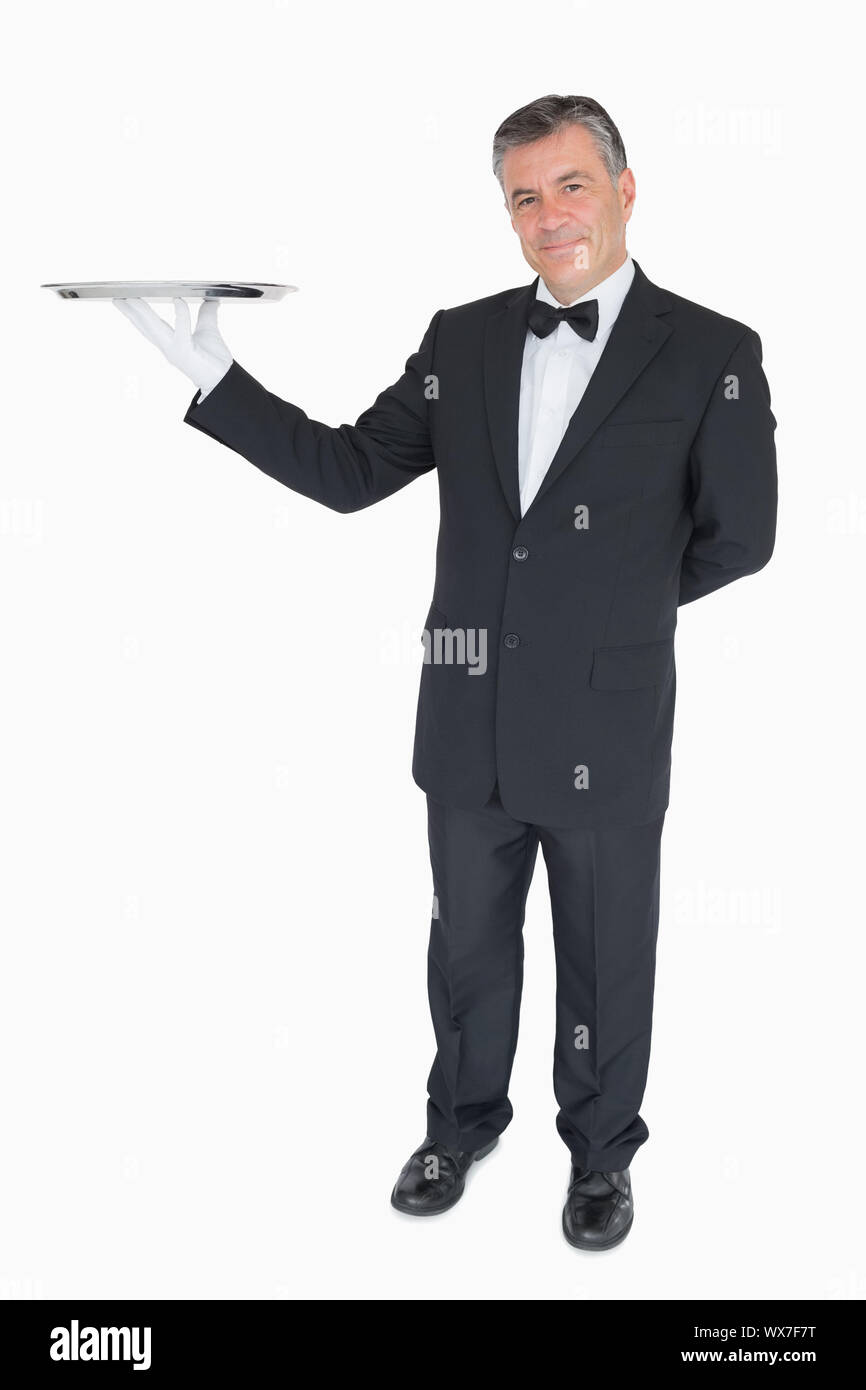 Waiter holding tray high hi-res stock photography and images - Alamy