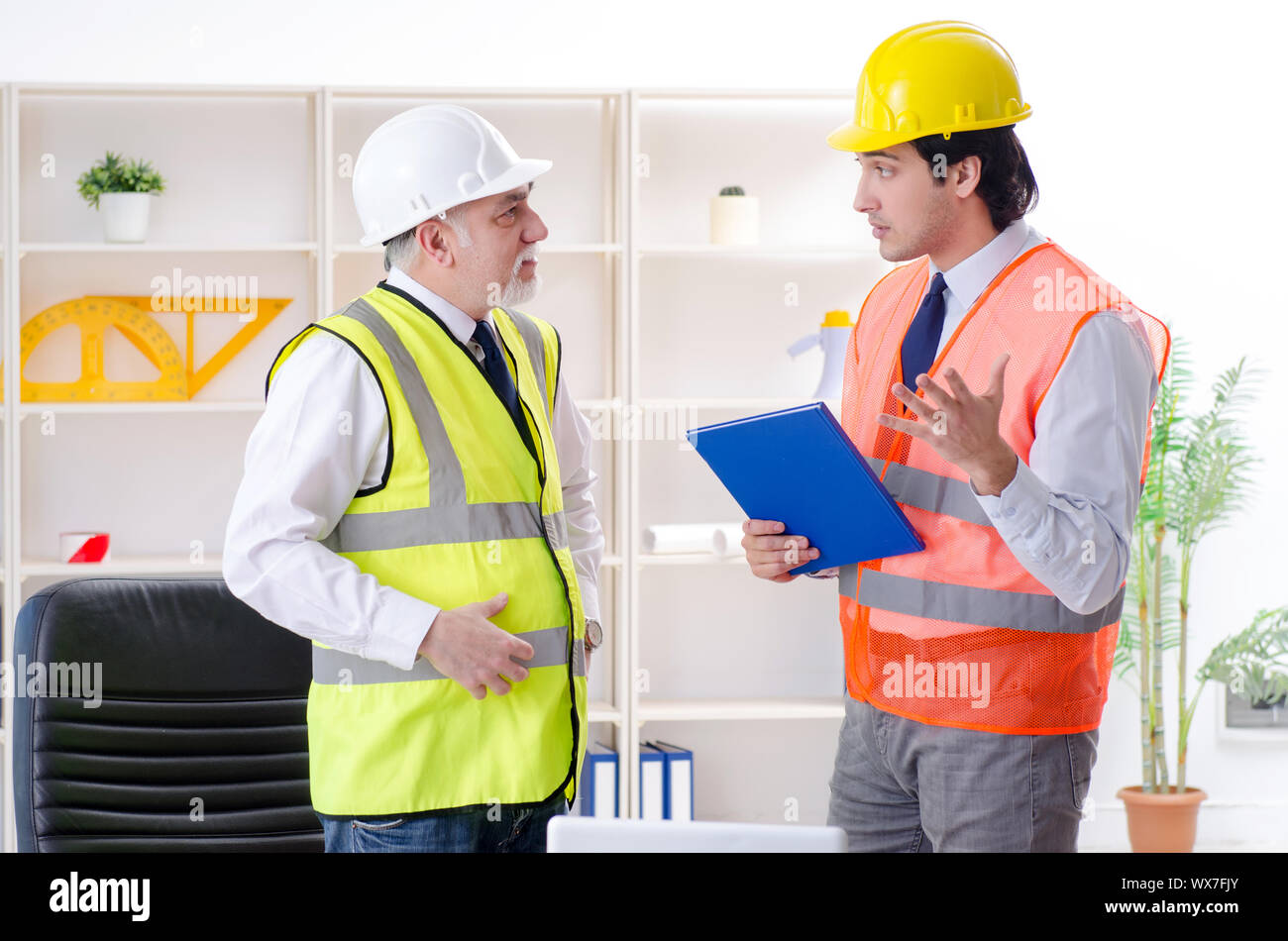 Two engineers colleagues working under project Stock Photo - Alamy