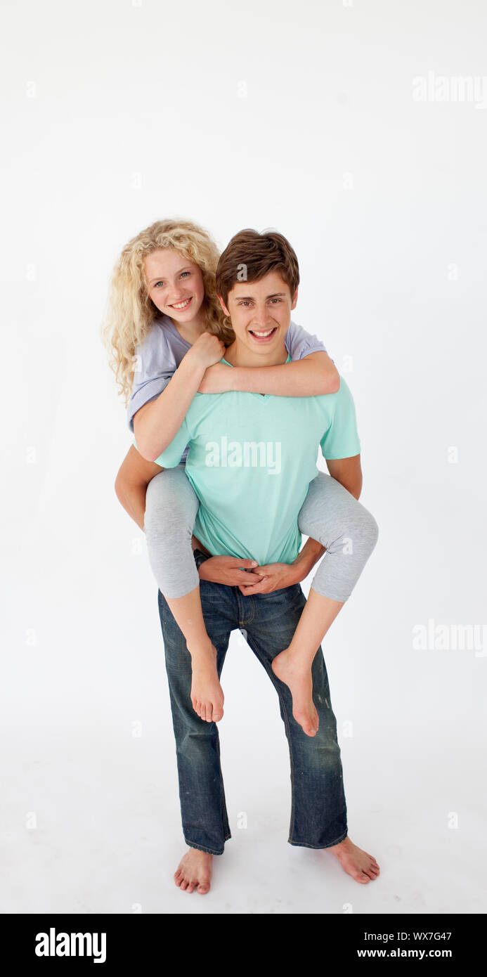 Young Man Giving Girlfriend Piggyback Ride At Night On Parking Lot Stock  Photo - Download Image Now - iStock