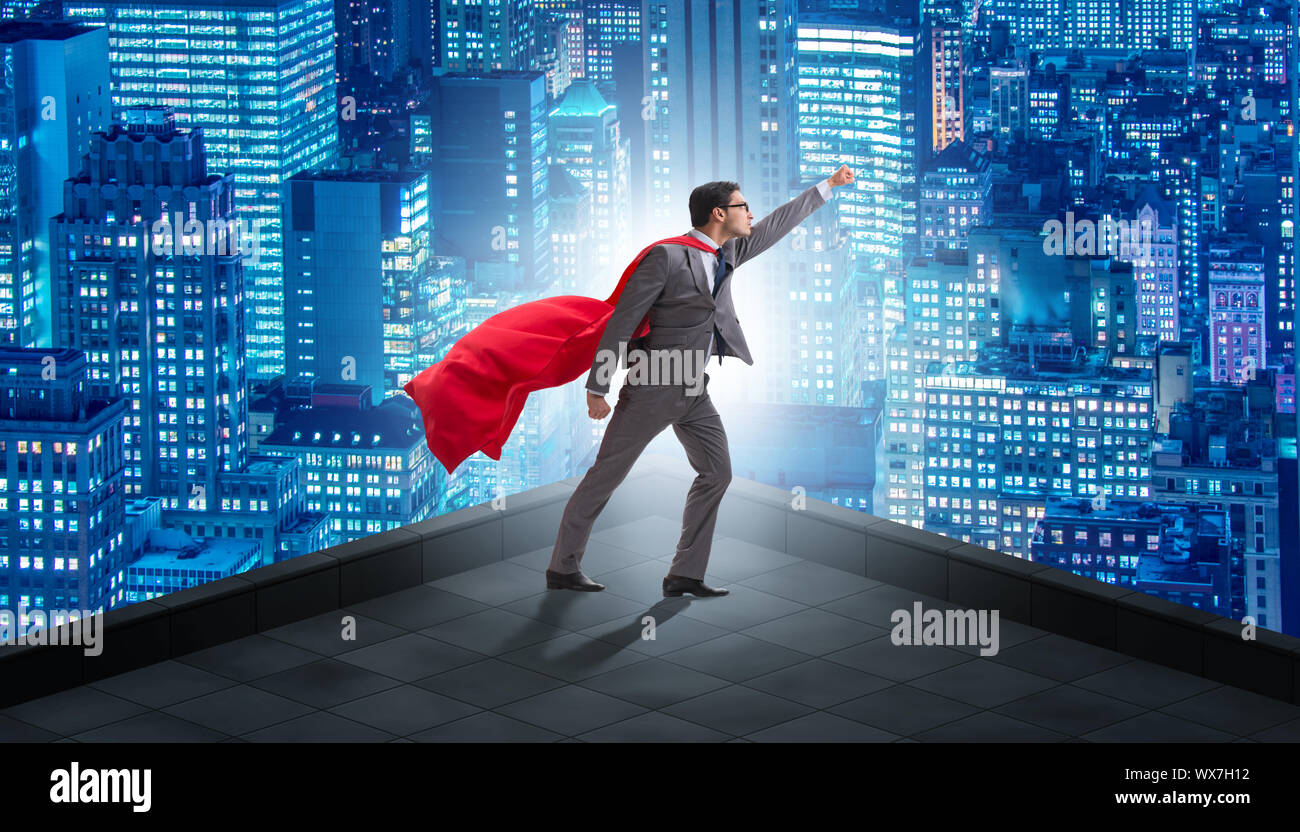 Superhero businessman on top of building Stock Photo - Alamy