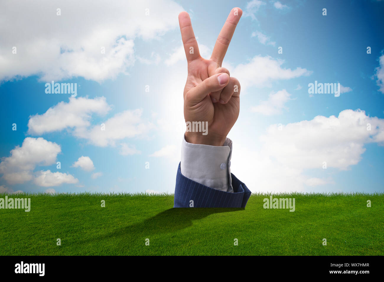 Hands showing victory sign in business concept Stock Photo - Alamy
