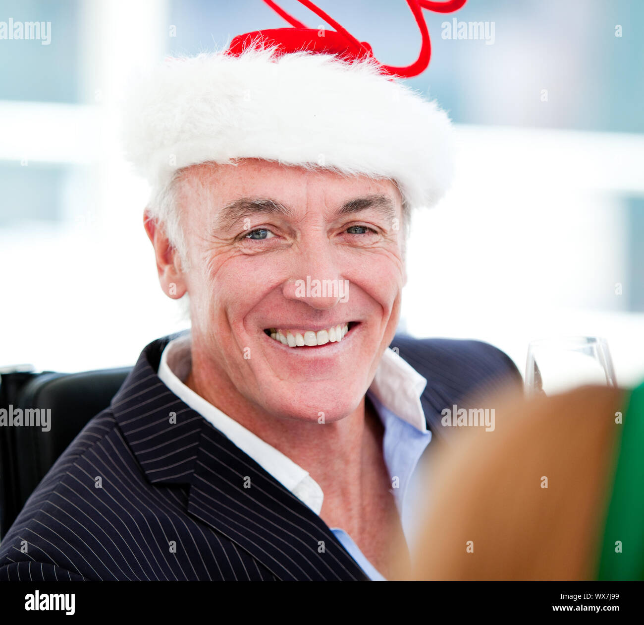 Mature businessman celebrating christmas in the company Stock Photo Alamy