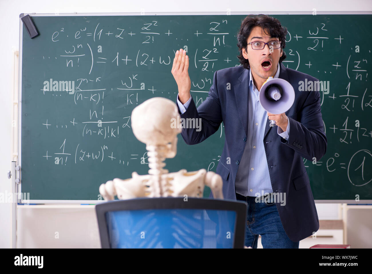 Young male math teacher and student skeleton Stock Photo