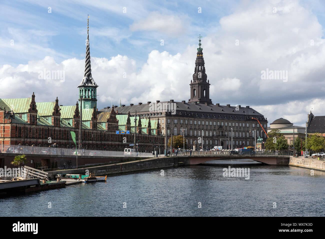 The Christiansborg Palace and Børse building, left, the 17th century former stock exchange, with the canal in the foreground Stock Photo