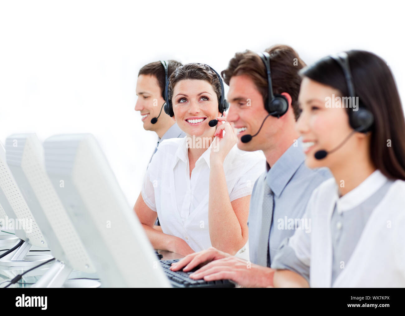 Portrait of enthusiastic customer service agents working in a call