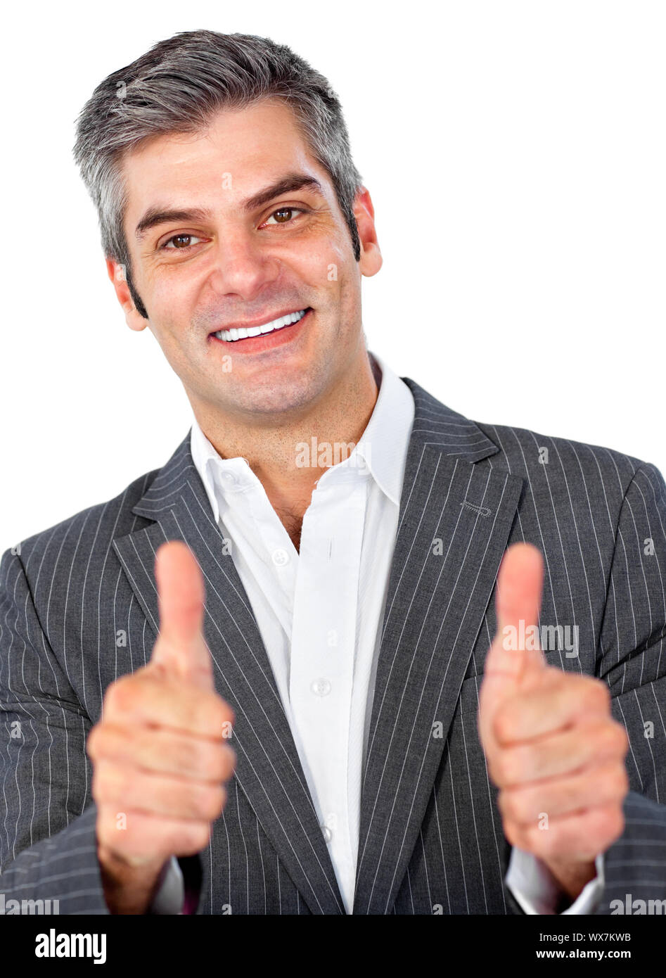 Happy businessman with thumbs up against a white background Stock Photo ...