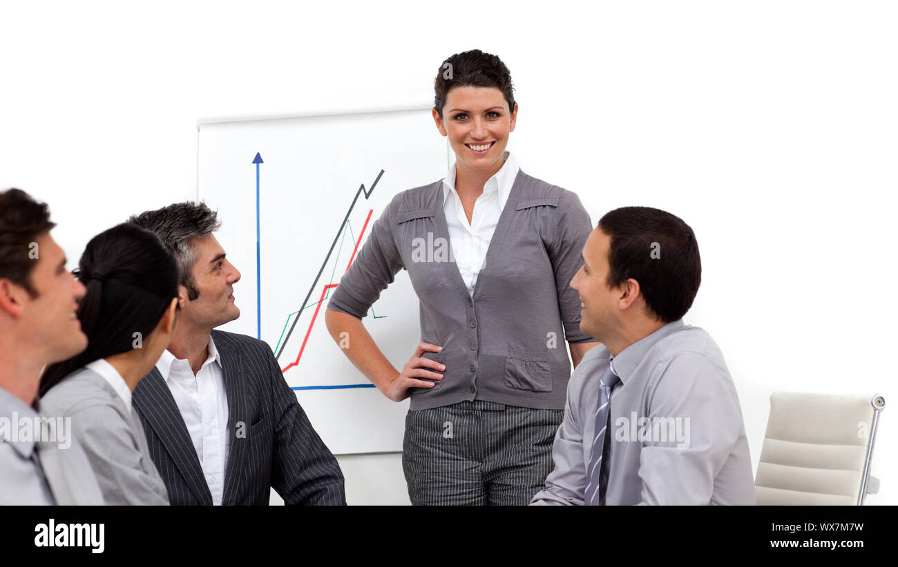 Charming businesswoman giving a presentation to her team Stock Photo ...