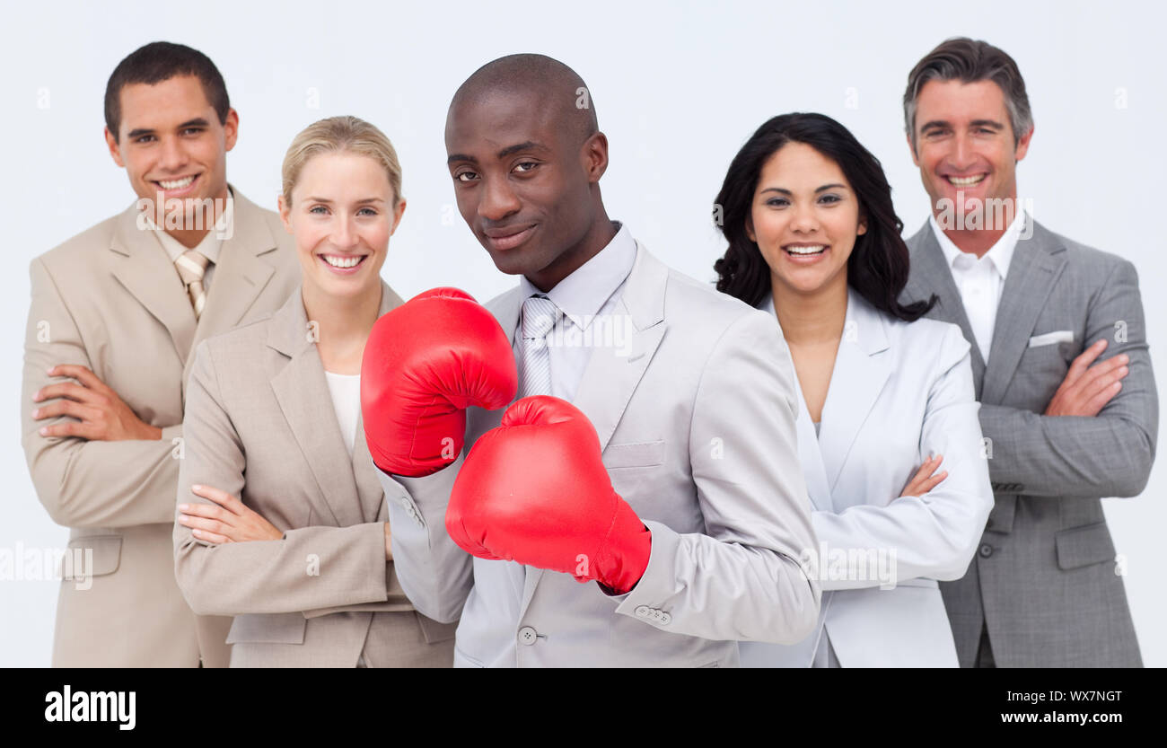 Attractive Afro-American businessman with boxing gloves leading his ...