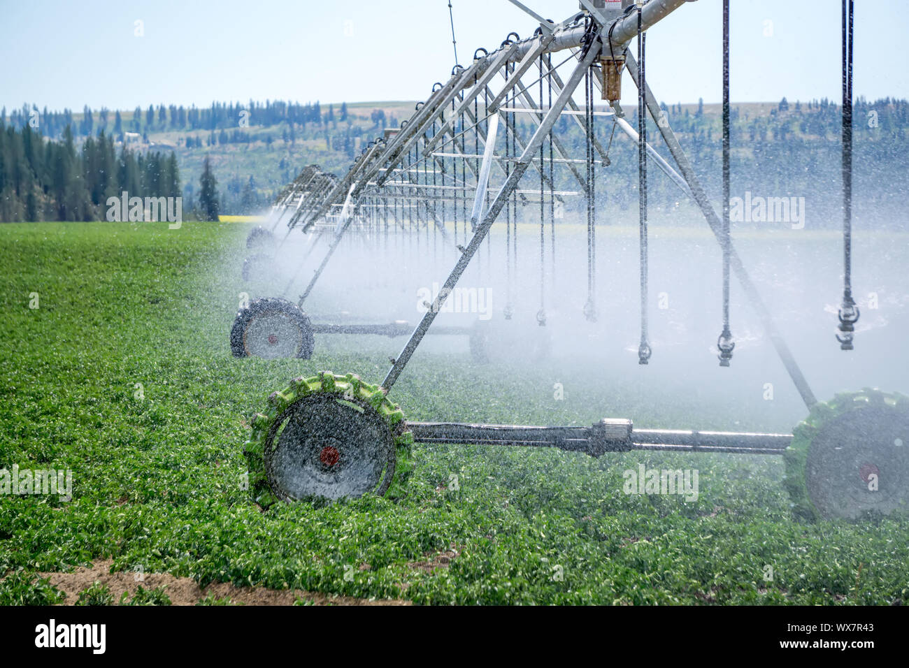 Irrigation equipment on farm field on sunny day Stock Photo Alamy